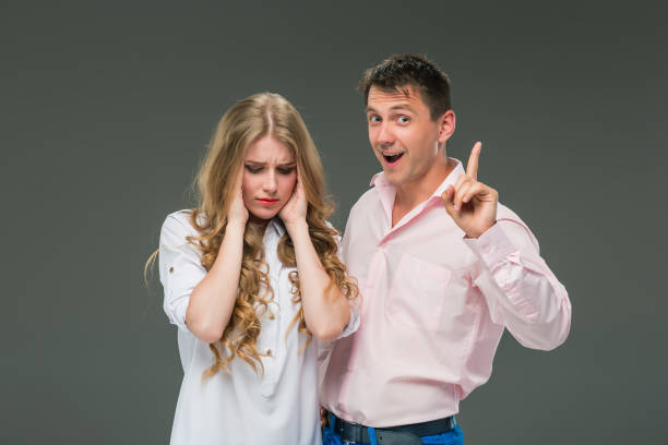 istock The young couple with different emotions during conflict 695909262