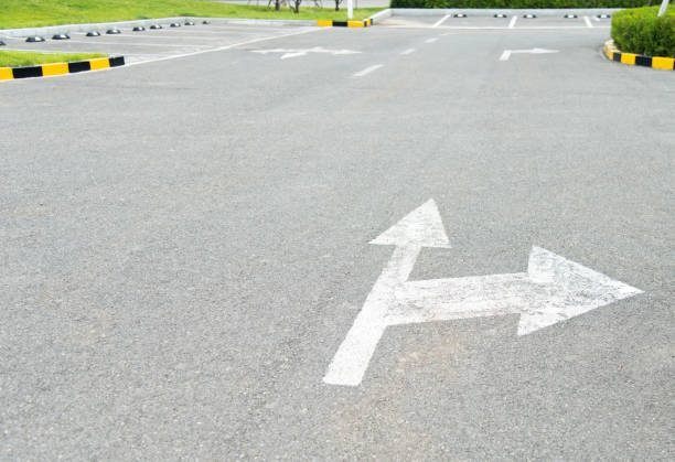 Arrow sign direction on parking lot floor