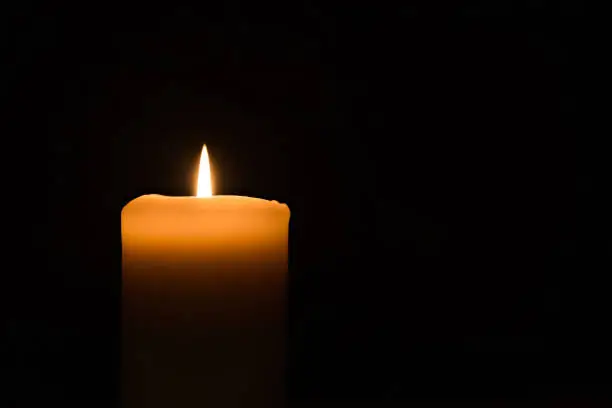 Photo of candle light on the black background