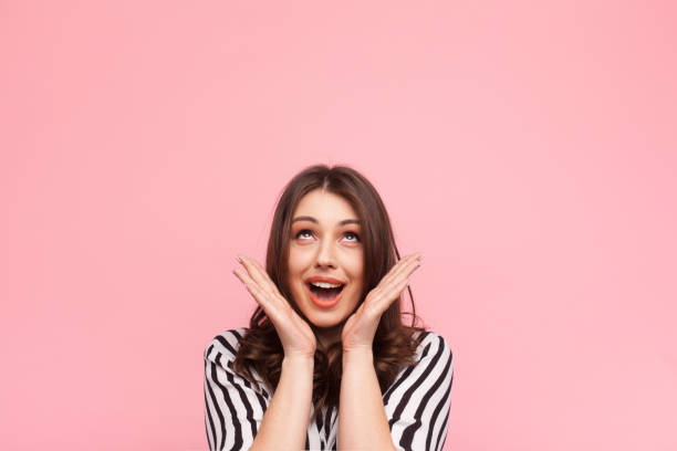 Lovely woman posing on pink
