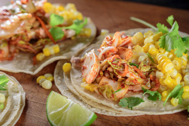 istock Kimchee Tortilla with Grilled Salmon on White Corn Tortilla 695925176