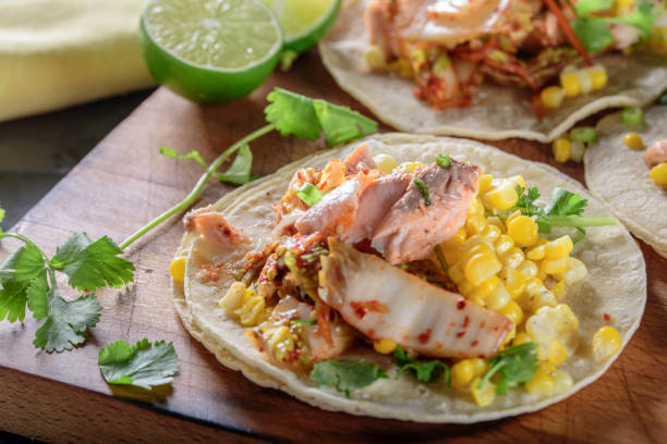 istock Kimchee Tortilla with Grilled Salmon on White Corn Tortilla 695925274
