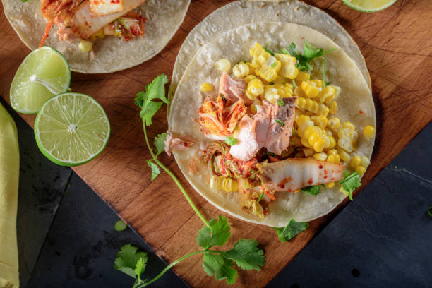 istock Kimchee Tortilla with Grilled Salmon on White Corn Tortilla 695925348
