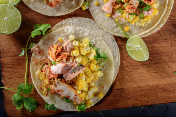 istock Kimchee Tortilla with Grilled Salmon on White Corn Tortilla 695927538