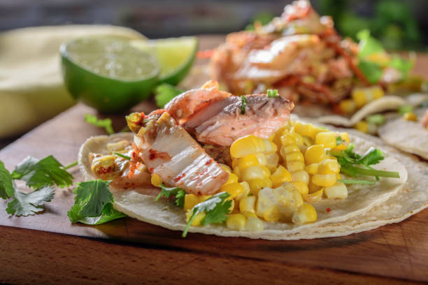 istock Kimchee Tortilla with Grilled Salmon on White Corn Tortilla 695927836