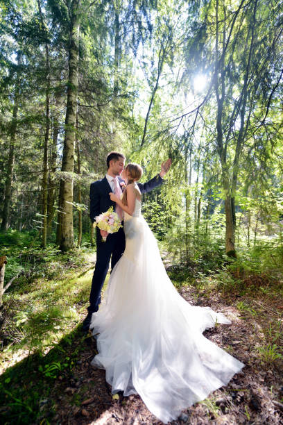 istock Wedding couple on the nature is hugging each other 695928126