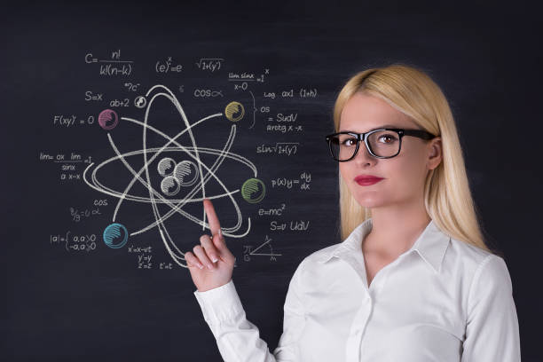istock Business woman and atomic molecule on the blackboard 695928390