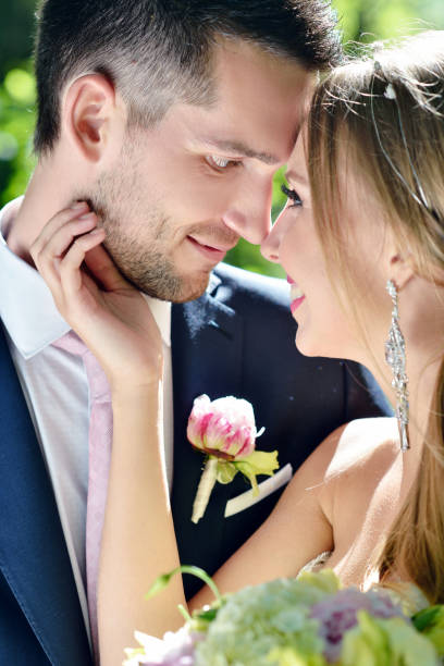 istock Wedding couple on the nature is hugging each other 695931736
