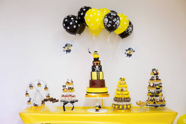 Birthday party sweets table for boy in yellow and black pirate theme
