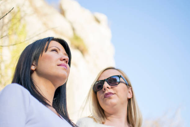 istock Sisters Hanging Out At A Park 695935876