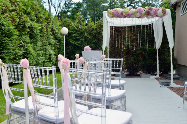 istock Beautiful wedding arch and chairs for marriage 695936186