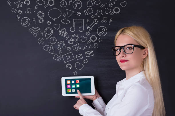 istock Business woman with tablet on the blackboard 695936658