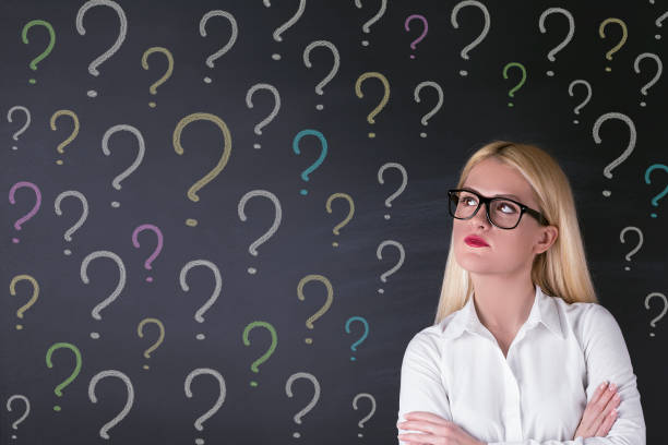 istock Business woman and question marks 695936738
