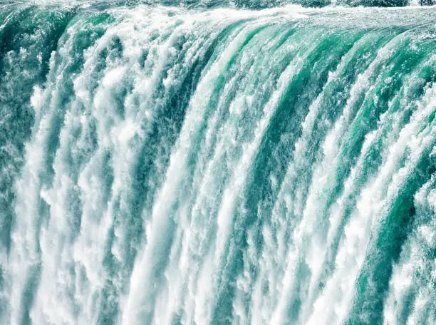 A very fast shutter speed used to freeze the motion of water plunging down the Horseshoe Falls at Niagara.