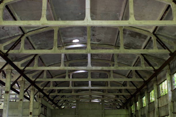 istock Cement beams inside an old building on the ceiling 695943050