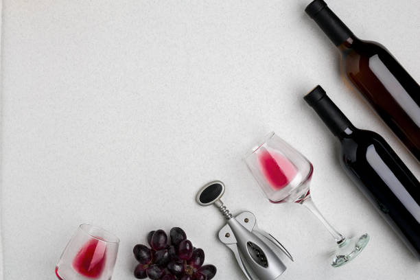 istock Two glasses of red wine and grapes. Top view 695944204