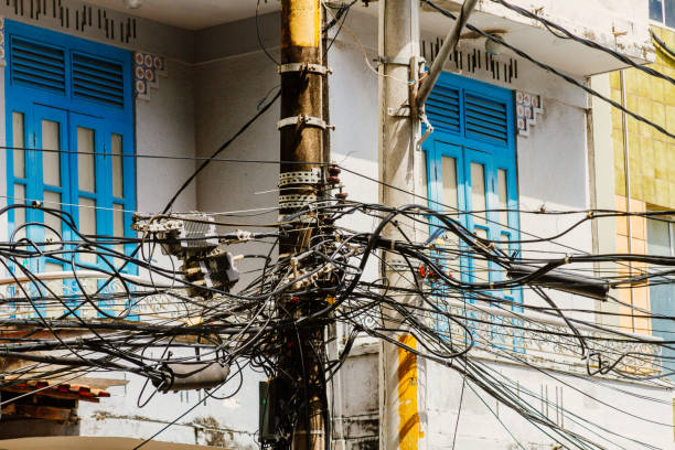 istock Cables tangled in a street pole 695944396