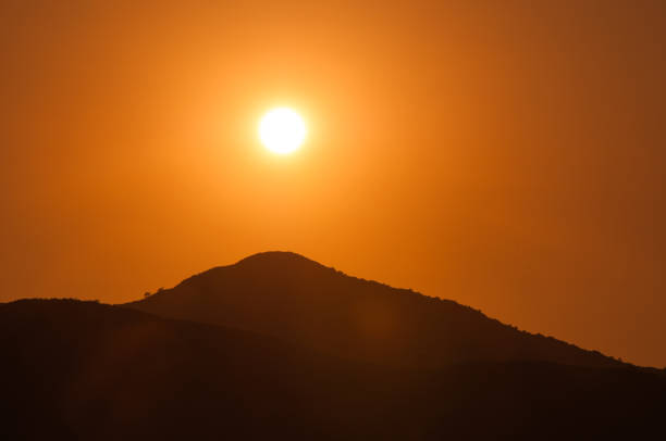 istock Orange sunset in the mountains. View from a height 695948228