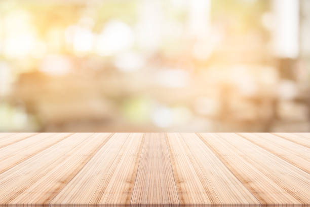 istock table top on blurred background,Space for placing products 695951560