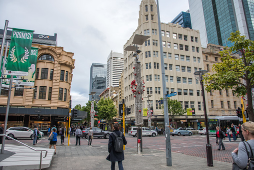 Perth,WA,Australia-November 16,2016: City intersection with crowds, retail buildings and traffic by the Hay Street Mall in downtown Perth, Western Australia.