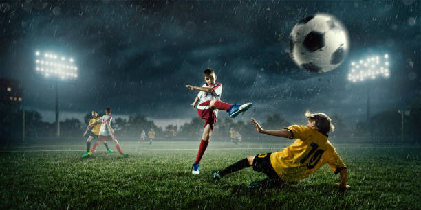istock Soccer kids players in action in 3D dramatic stadium 695968578