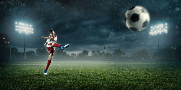 istock Soccer kids player in action in 3D stadium 695969228