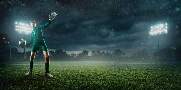 istock Soccer kids goalkeeper throws the ball 695969668