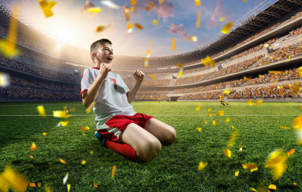 istock Soccer kids player rejoice at victory 695970574