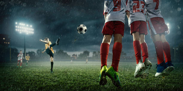 istock Soccer kids player makes a free kick 695970626