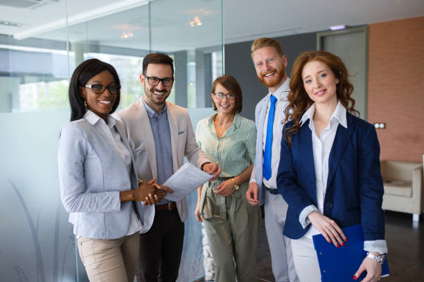 istock Group portrait of successful office team at work 695970634