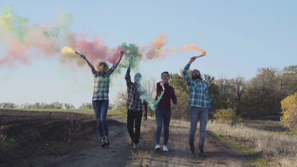 istock Youth with colored smoke grenades 695971600