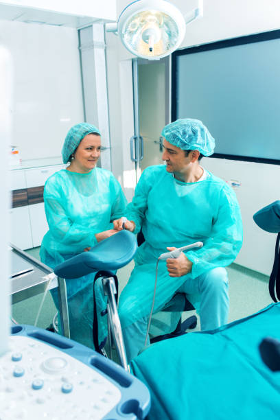 istock Gynecologist prepares for surgery in operating room 695975640