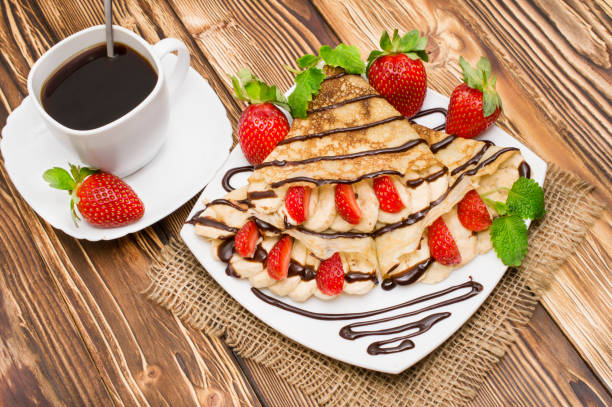 istock Crepes with Banana and strawberries 695979232