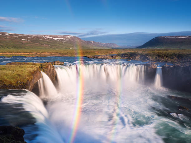 istock Godafoss waterfall and rainbow on a sunny day 695979716