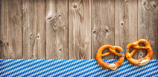 Rustic background for Beer Fest Rustic background for Beer Fest with Bavarian white and blue fabric and pretzels bavarian flag stock pictures, royalty-free photos & images