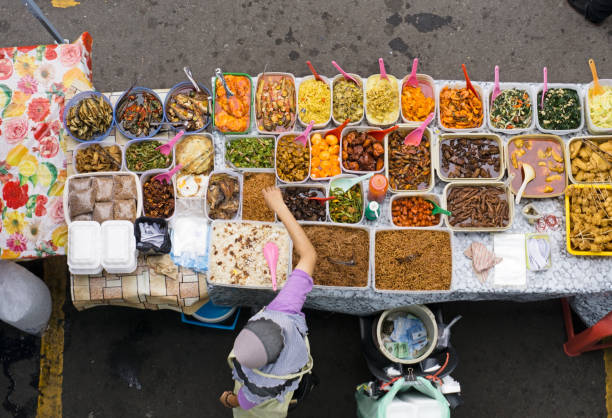 Top view of hawker at street food bazaar in Malaysia Kota Kinabalu, Malaysia - June 10, 2015: Top view of vendor owner selling  ramadan bazaar stock pictures, royalty-free photos & images