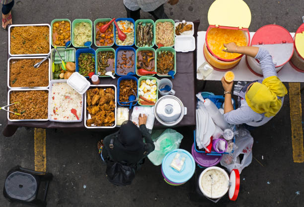 Kota Kinabalu, Malaysia - June 10, 2015: Top view of vendor owner selling 