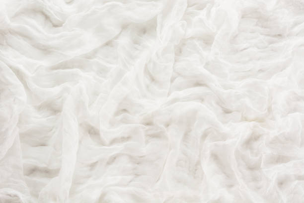 繊維から白い背�景。抽象的なパターンを描画します。平面図です。 - gauze bandage textured white ストックフォトと画像