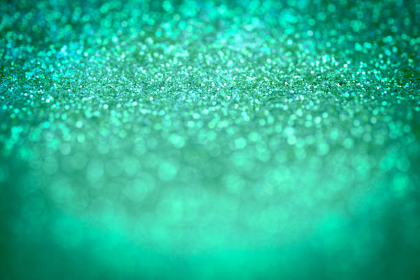 istock Bright and abstract blurred green bokeh background with shimmering glitter 696001898