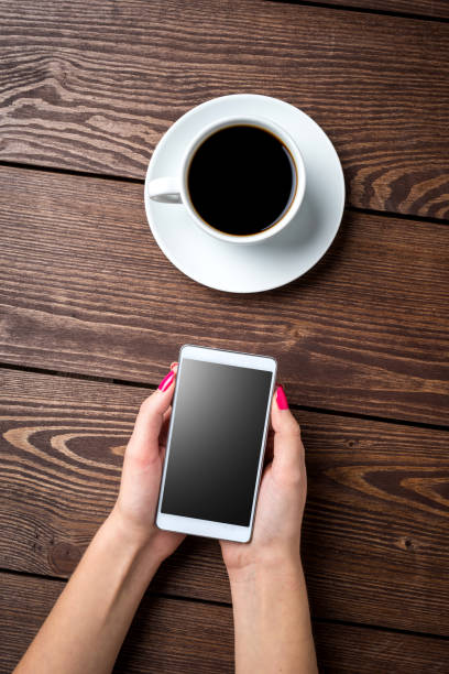 istock Woman holding smart phone 696007044