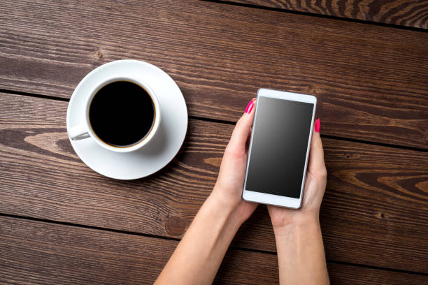 istock Woman holding smart phone 696009222
