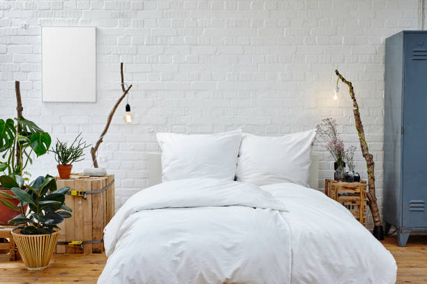 istock creative interior design urban loft white bed and vivid plants 696009392