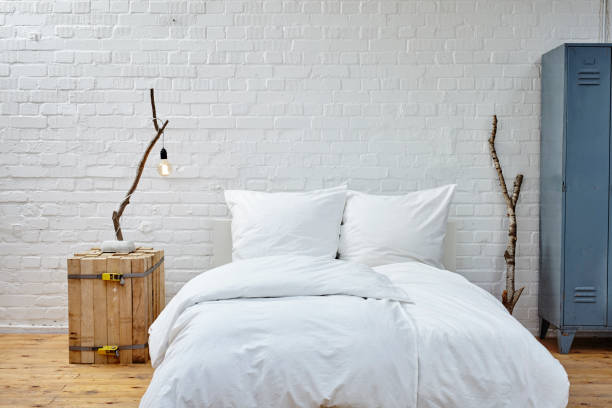 istock loft atmosphere bedroom white linen and birch branches 696009468