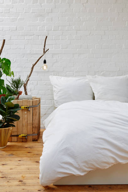istock creative urban interior design bedroom white linen 696009470