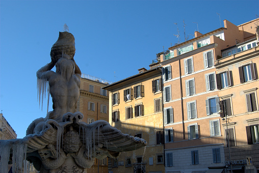 PLAZA BARBERINI UNDER THE INTENSIVE COLD WINTER. THE WATER FROM THE SOURCE OF THE FROZEN TRITON AND WITH ICE CARAMBANES.