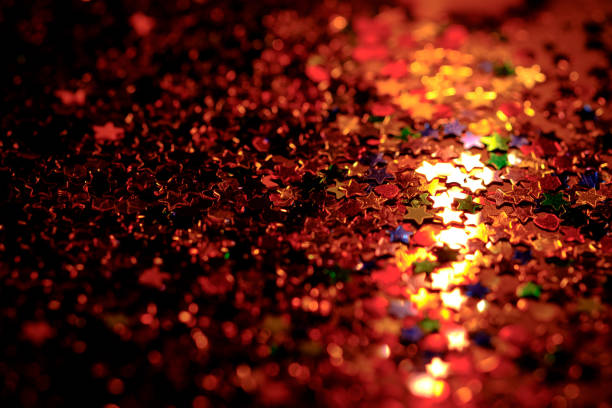 istock colourful star confetti with soft candles light golden tone  , liberty concept 696012256