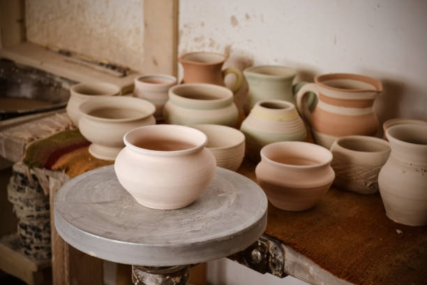 istock Clay pot on a potter's wheel 696021648