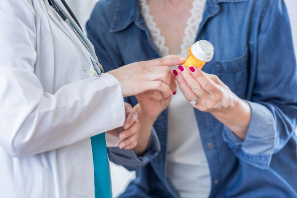 istock Unrecognizable doctor talks with senior female patient 696021788