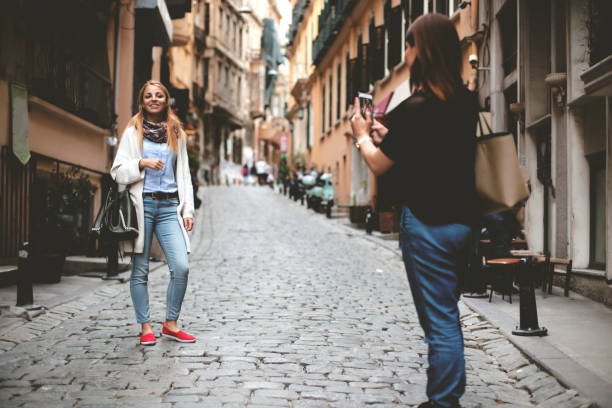 istock Two girls take photo 696023136