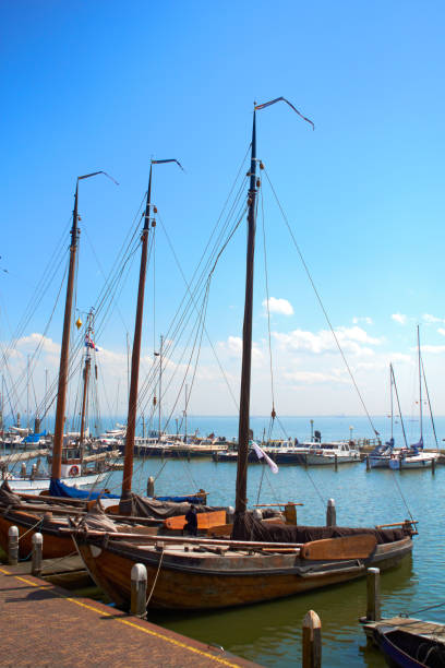 Moody shots of boats tied alongside the moorings at Volendam, Holland stock photo